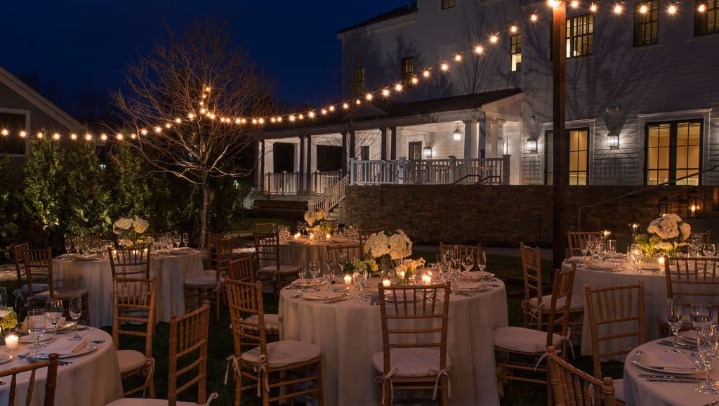 Kimpton Taconic Wedding Photos Reception Coutryard Tables at Night with Lights