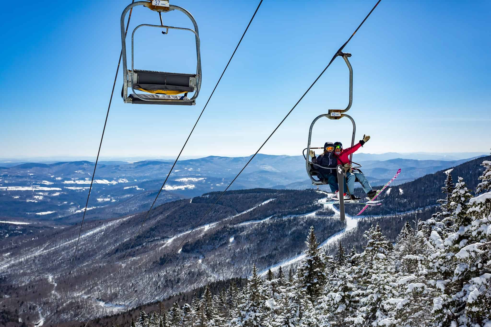 Sugarbush Resort - Skiing Couple on Chairlift