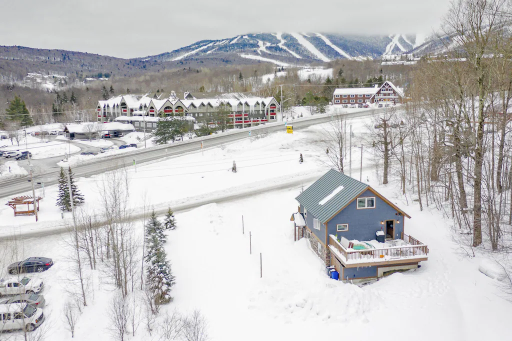5 BR with a View & Hot Tub --> UNBEATABLE location Winter Exterior Across from Ski Mountain