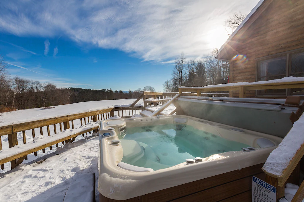 Amazing Vermont Estate with 2 houses, 11 bedrooms, a pool, sauna, and game Hot Tub in Snow