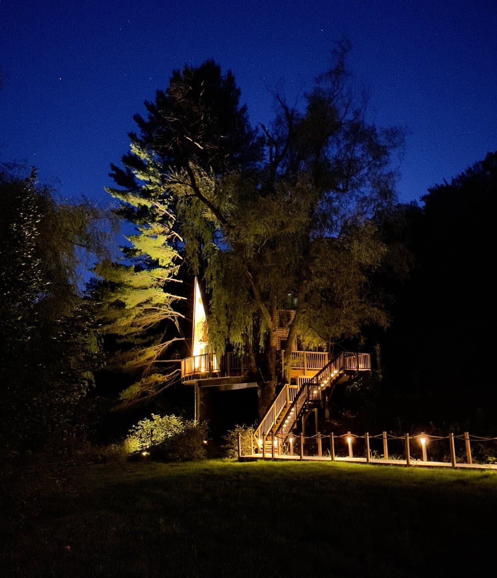 Willow VT Treehouse Lit Up at Night