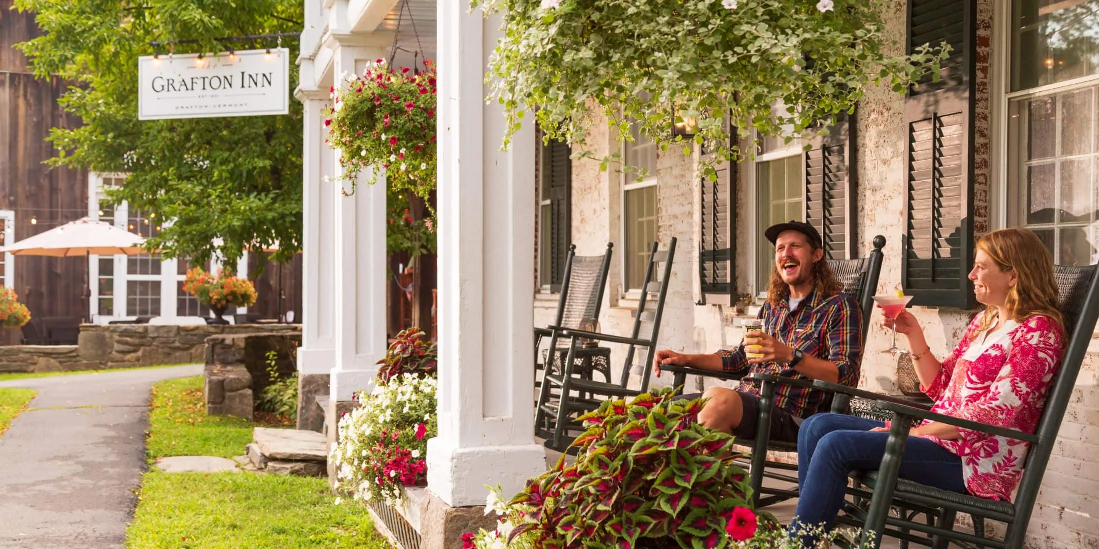Grafton Inn Summer Porch Sitting Couple with Martinis in Sunlight